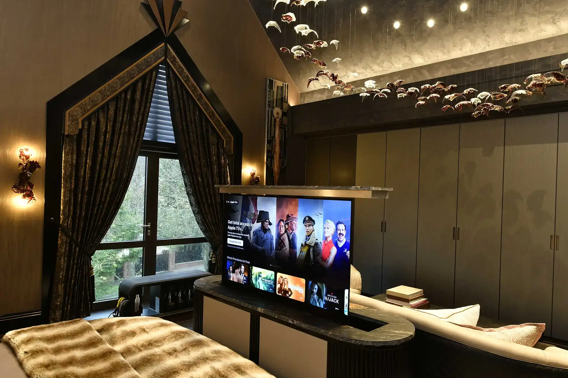 All TVs in the property are on motorised mounts that automatically hide the screens away when not in use
