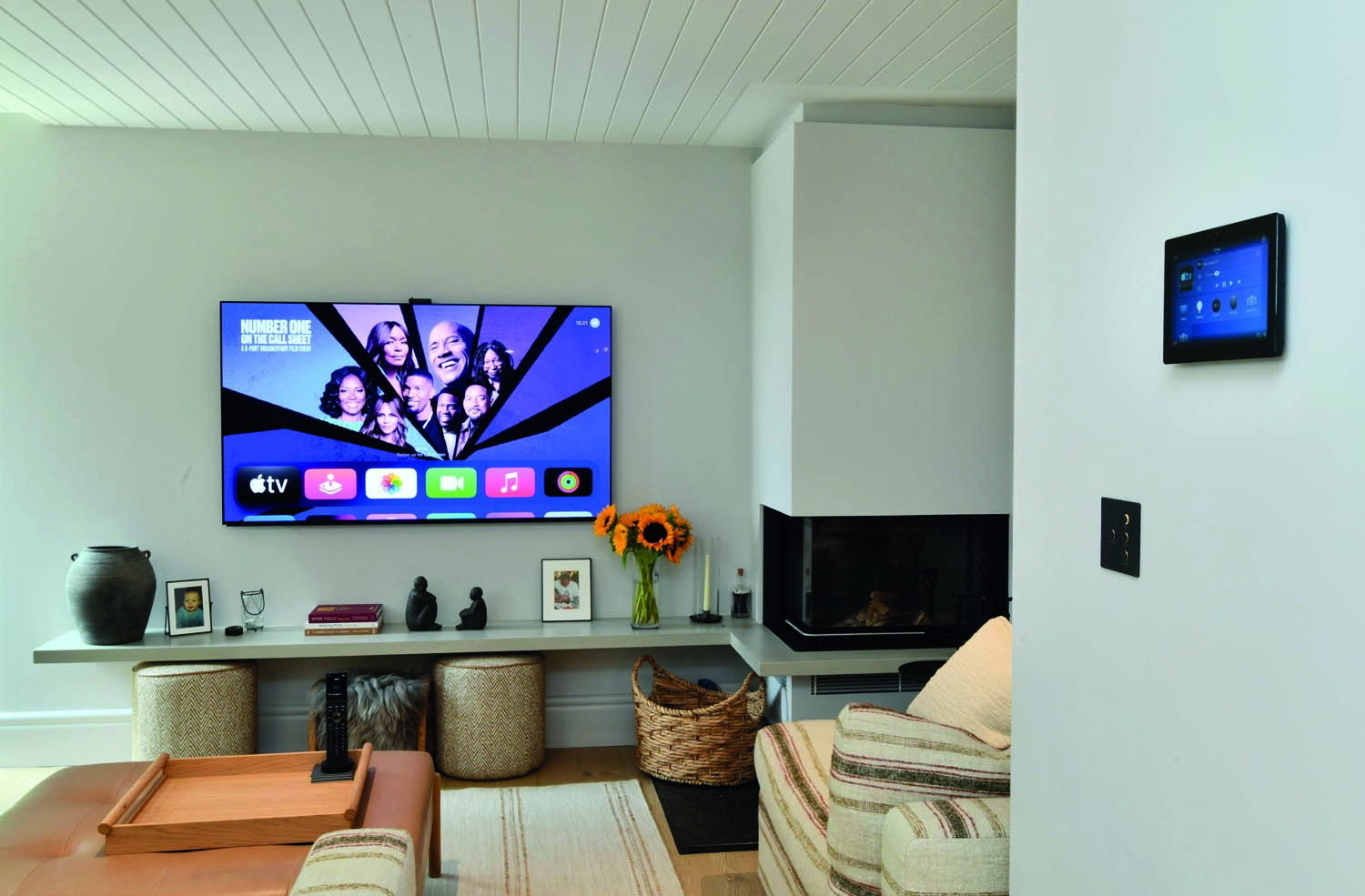 Wall-mounted touch screens are located around the home for monitoring and control