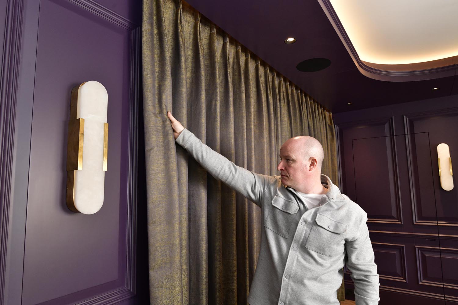 A gentle tug of the curtains activates the automated blackout blinds and drapes